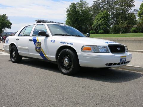 1991 Ford LTD Crown Victoria - white Philadelphia Police Highway Patrol Crown Victoria seen from the passenger front three-quarter, marked H1A and 511, parked on a road.