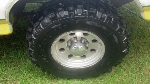 1983 Ford F-250 - This image shows a close-up view of a vehicle's wheel and tire, likely for sale as a part.