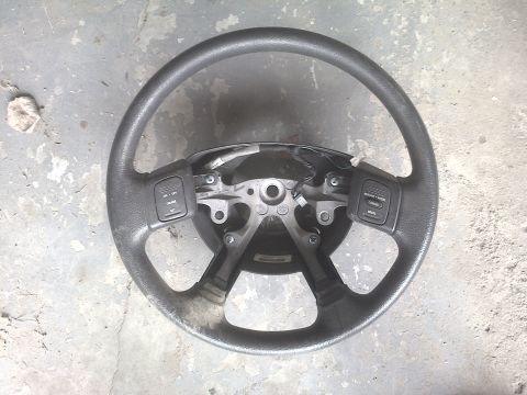 2005 Dodge 3500 - This steering wheel, likely from a 2005 Dodge 3500, is shown from a top-down perspective with visible wear.