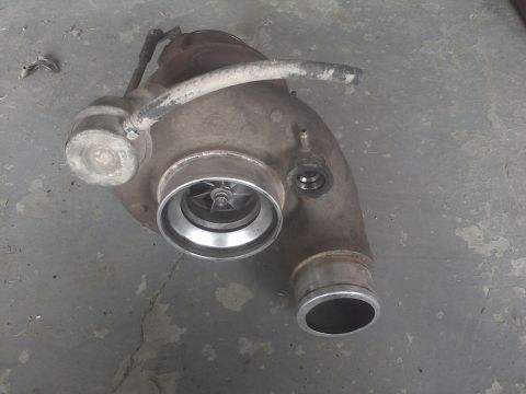 2005 Dodge 3500 - Turbocharger part shown on a concrete floor.