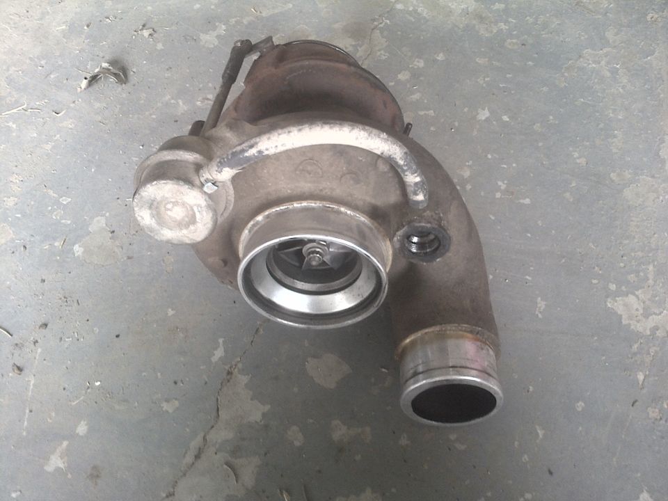 Turbocharger with intake and exhaust housings. Turbine wheel visible