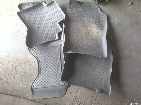 2005 Dodge 3500 - Set of four grey rubber floor mats with a diamond tread pattern, suitable for various vehicle interiors.