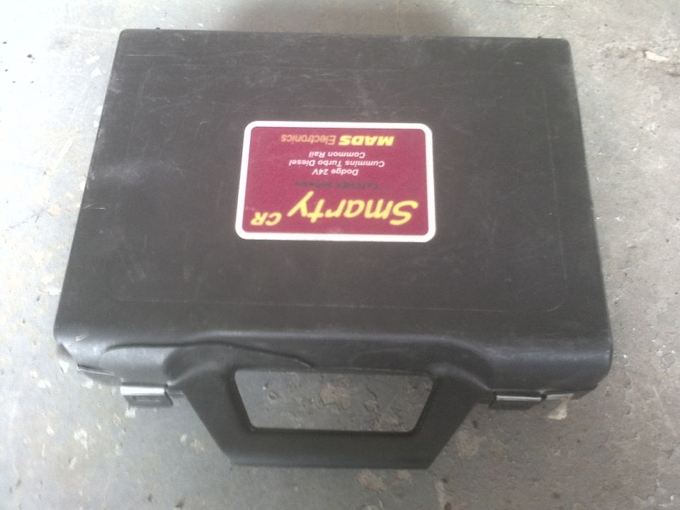 Black case with a red and yellow sticker that says Smarty CR, Dodge 24V Cummins Turbo Diesel, Common Rail, MADS Electronics