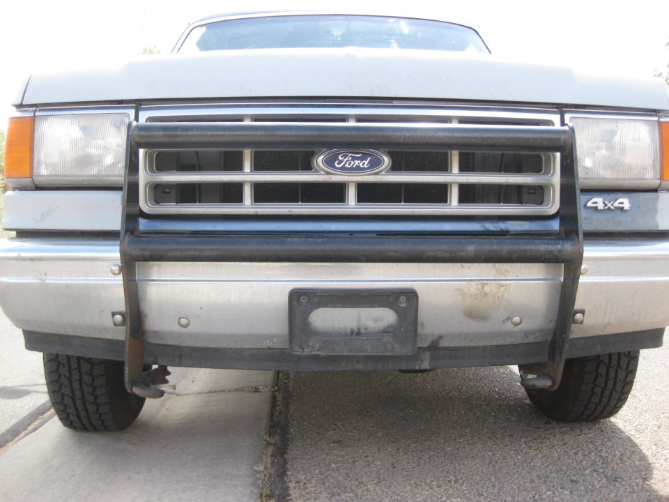 1988 Ford Bronco front view with grille guard and 4x4 badge
