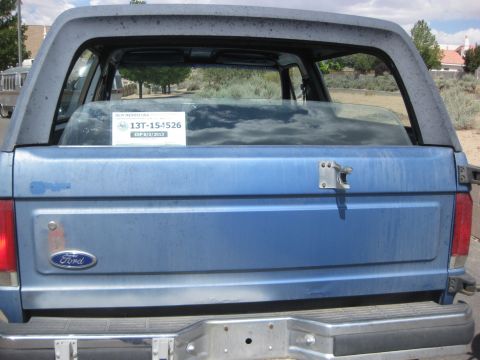 1988 Ford Bronco - The rear of a blue Ford Bronco shows a license plate with an expiration date in 2013.