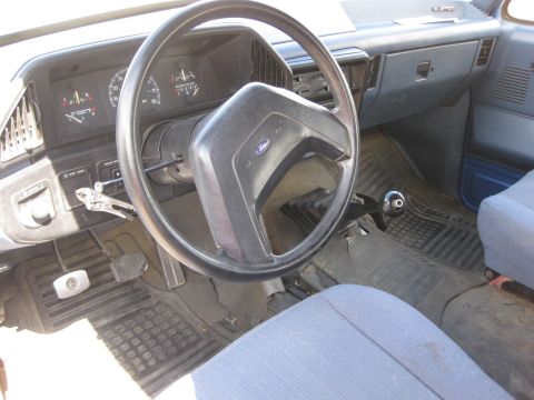 1988 Ford Bronco - Interior view of a 1988 Ford Bronco, the dashboard and steering wheel.