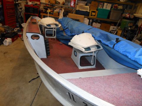 1996 Ford F-150 - Boat interior with seats and blue cover, stored indoors.