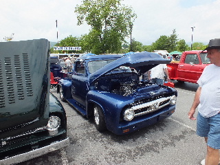 2013 Ford F-100 - Customized blue 1950s Ford F-series pickup truck on display at a car show.