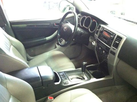 2003 Toyota 4Runner - The interior of a 2003 Toyota 4Runner is visible, the dashboard, steering wheel, and center console.