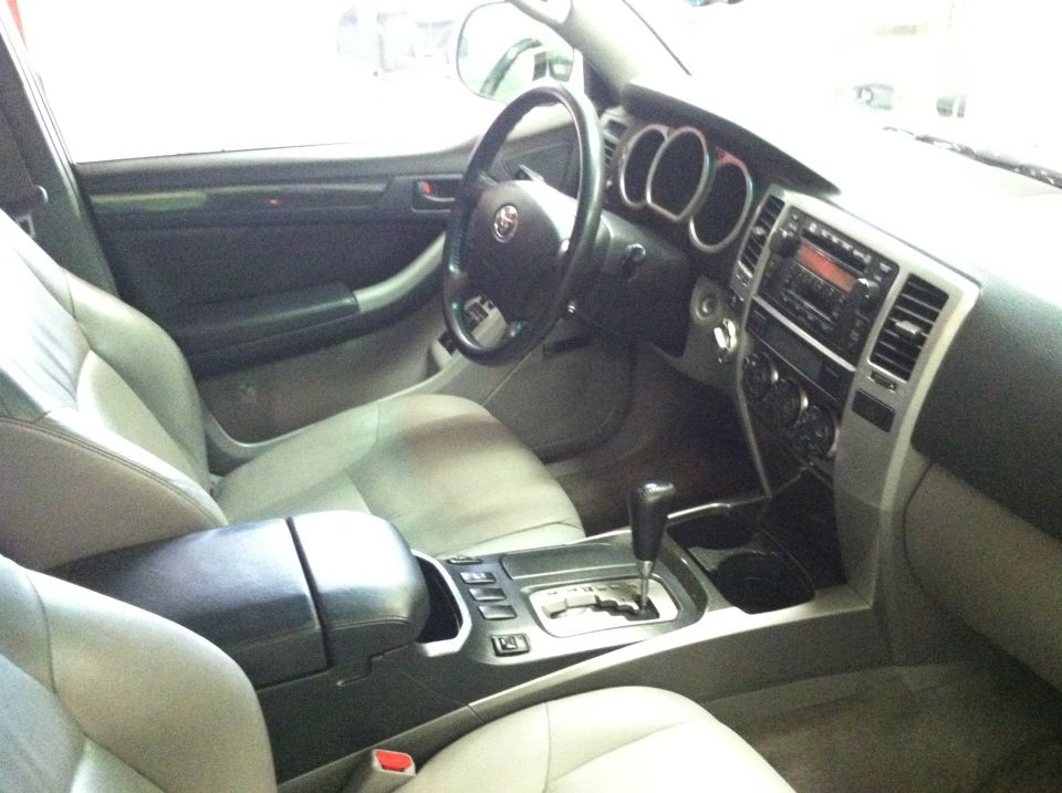 Interior of a 2003 Toyota 4Runner showing dashboard, steering wheel, and center console