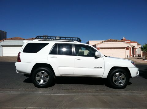 2003 Toyota 4Runner - This 2003 Toyota 4Runner Limited 4WD is shown from the side, a roof rack and alloy wheels.