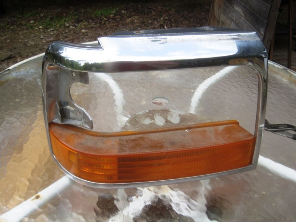 Chrome and amber headlight assembly for a 1992 Ford Bronco