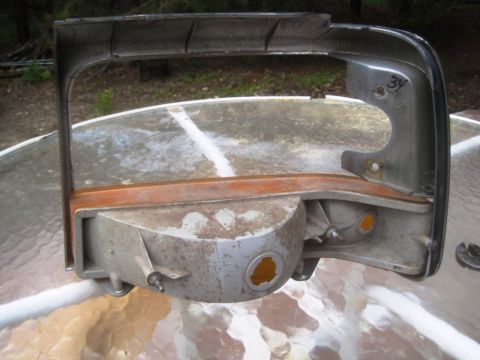 1993 Ford Bronco - This is a disassembled headlight assembly from a Ford Bronco.