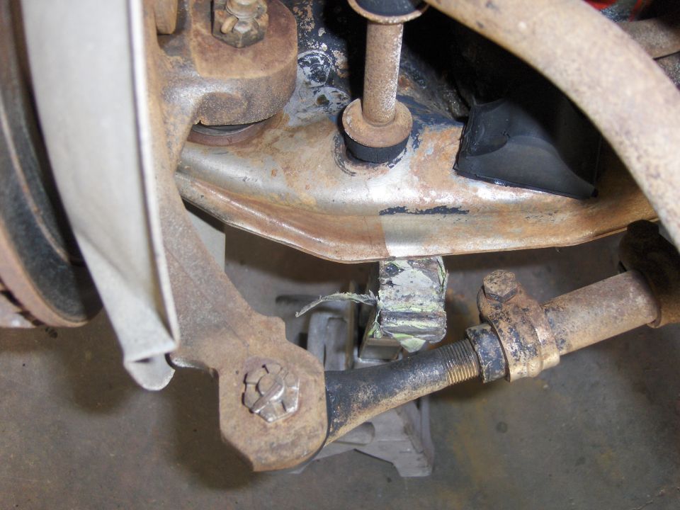 Front suspension linkage with a SuperMotors logo