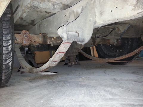 1967 Ford F-100 - Underside view of a vehicle's rear suspension system, showing leaf springs and frame.