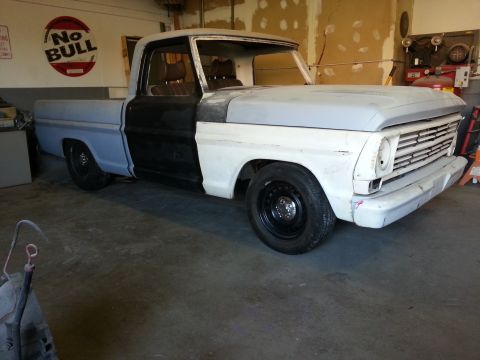 1967 Ford F-100 - This 1967 Ford F-100 pickup truck is undergoing restoration work in a garage.