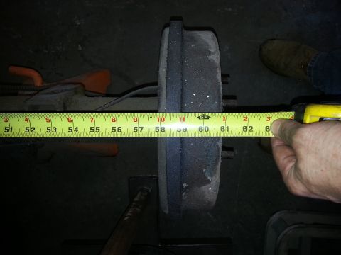 1967 Ford F-100 - Measuring a brake drum with a tape measure, showing its diameter.