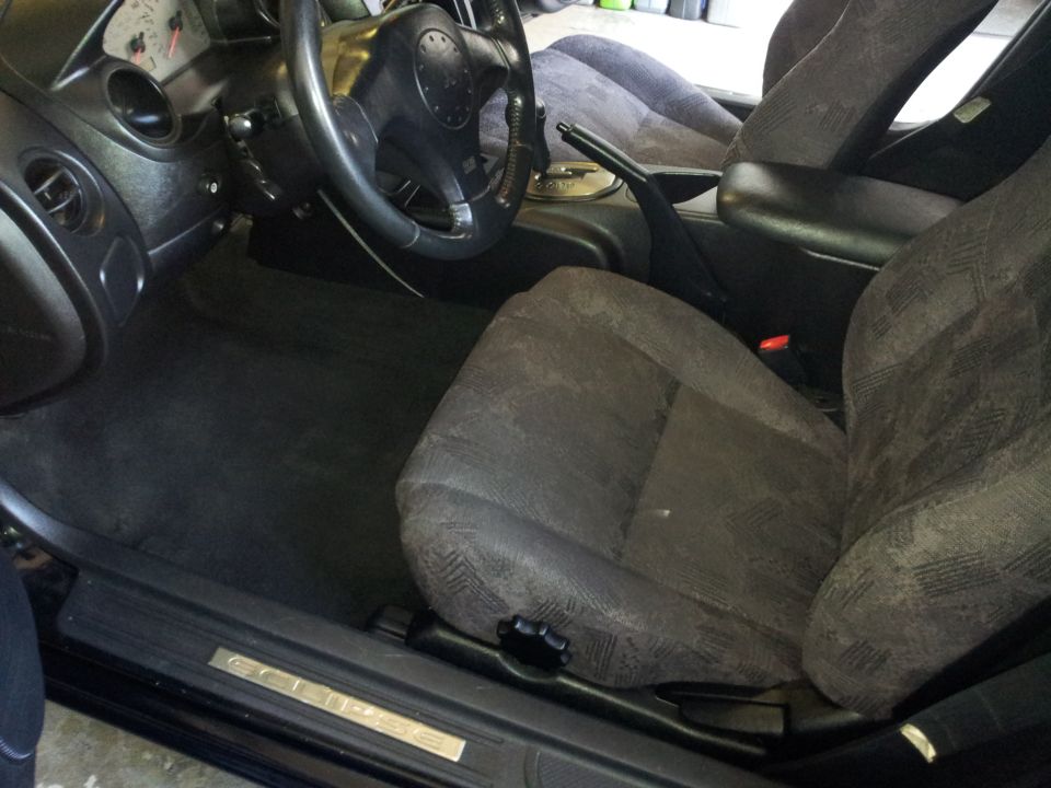 2001 Mitsubishi Eclipse interior showing driver's seat, dashboard, and steering wheel
