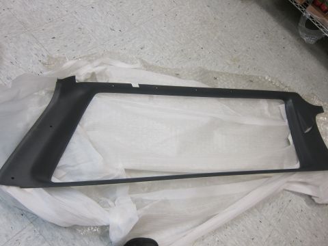 2001 Ford Crown Victoria - A car interior trim piece is shown on a white protective wrapping, likely for storage or shipping.
