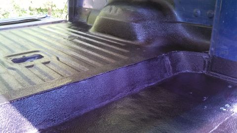 1979 Ford Bronco - Truck bed after receiving a fresh coat of black spray-on liner.