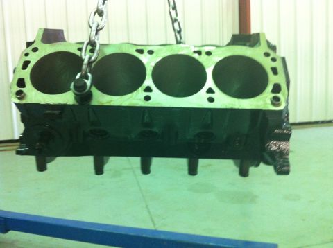 1992 Ford Bronco - This engine block is suspended by chains, ready for installation or repair.