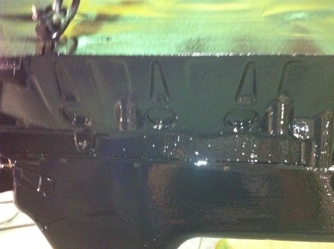 1992 Ford Bronco - Close-up view of a dark engine block, showing its textured surface and bolt holes.