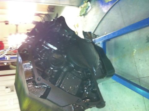 1992 Ford Bronco - A close-up view of a black engine block, possibly undergoing maintenance or rebuilding.
