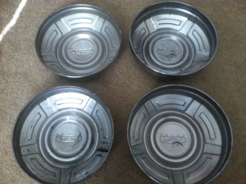 1977 Ford F-350 - These four hubcaps are for sale and appear to be from an older vehicle.