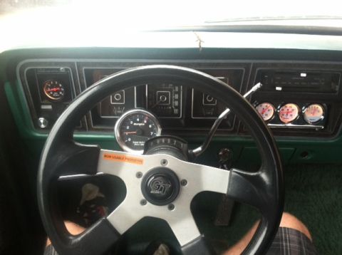 1977 Ford F-350 - Custom gauges and steering wheel installed in a 1977 Ford F-350 interior.