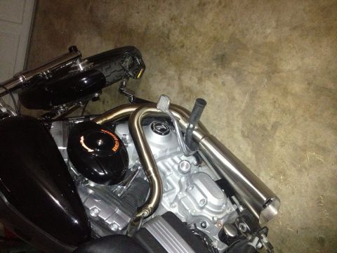 1995 Ford Bronco - The engine of a Harley-Davidson motorcycle is shown in detail, chrome and black components.