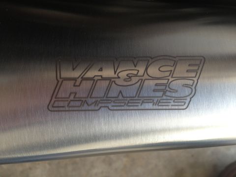 1995 Ford Bronco - Engraved Vance & Hines Comp Series logo on a metal exhaust component.