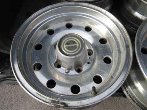1995 Ford Bronco - Close-up of a single Ford Bronco wheel, likely from the early to mid-1990s.