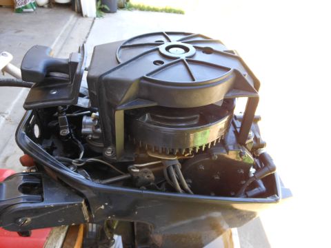 1996 Ford F-150 - Close-up view of an outboard motor, showing its internal components and black casing.