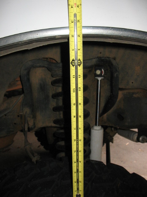 1995 Ford Bronco - Front jacked up, tire still on ground, 14". Probably could have got a bit more, but jack was not long enough.