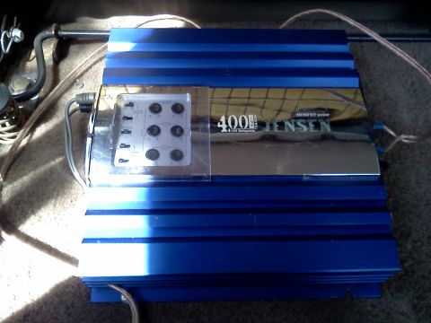 1995 Ford Bronco - A blue Jensen car amplifier, labeled as 400W, is visible with its connection terminals and wiring.