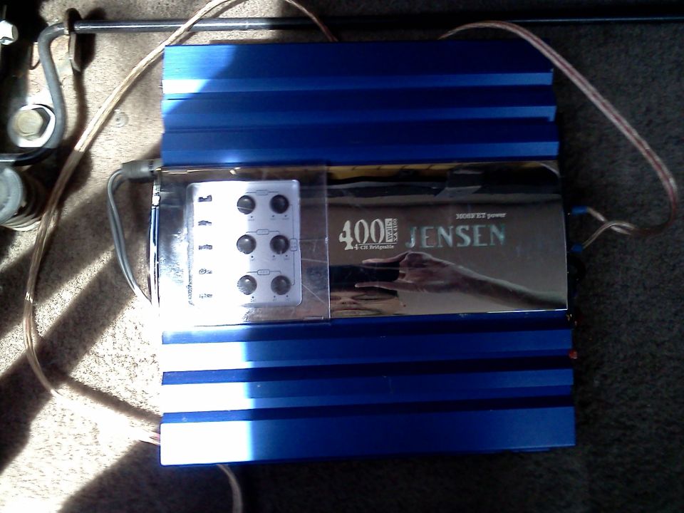 Blue Jensen 400W car amplifier with six knobs and various settings visible