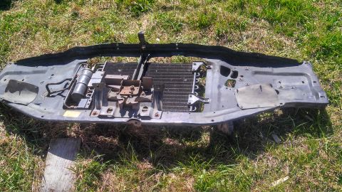 1979 Ford Bronco - Radiator support assembly removed from a vehicle, showing the condenser and mounting hardware.