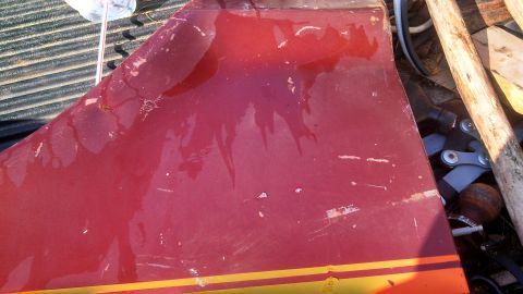 1979 Ford Bronco - A red car door with a yellow stripe is visible, along with the Supermotors logo at the bottom right.