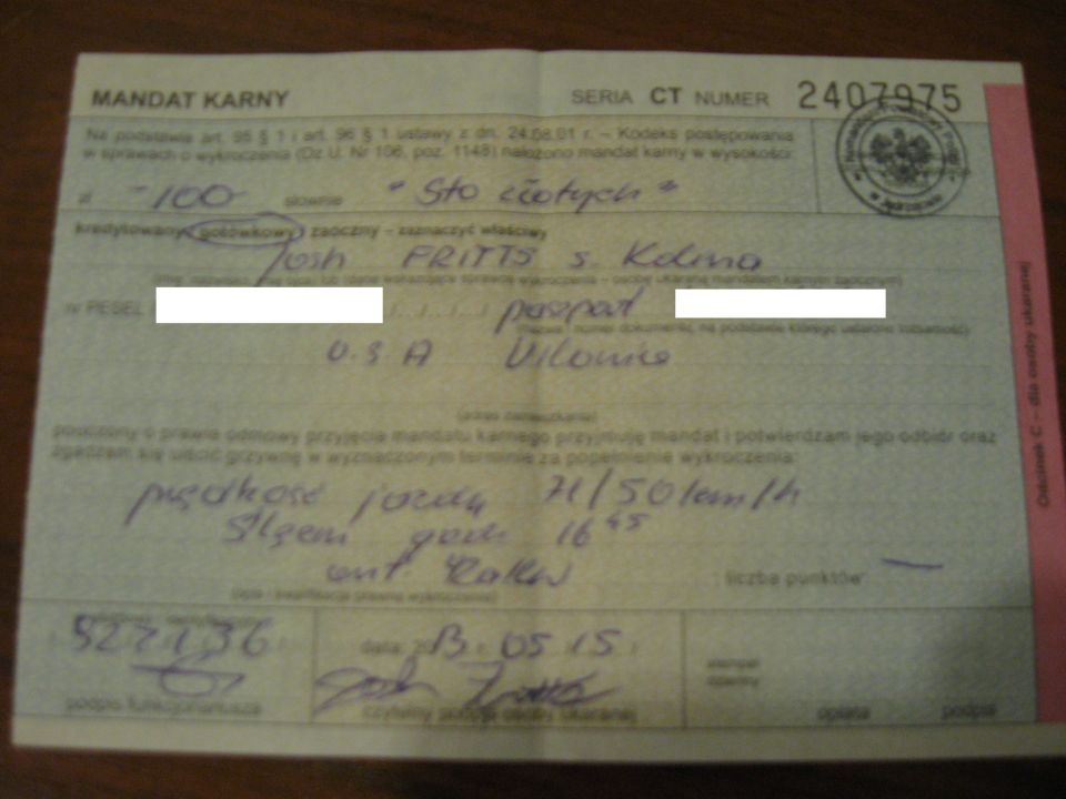 Traffic ticket document with handwritten Polish text and signatures