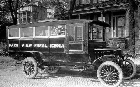 1909 Ford Model T - A vintage bus with "PARK VIEW RURAL SCHOOLS" painted on its side is seen from a three-quarter front angle.