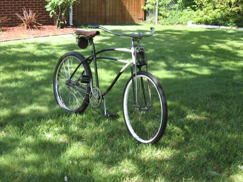 1994 Ford Bronco - A vintage-style bicycle with a unique frame design sits on a manicured lawn.