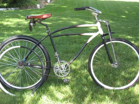 1994 Ford Bronco - A cruiser bicycle with a distinctive frame design sits on a grassy lawn.