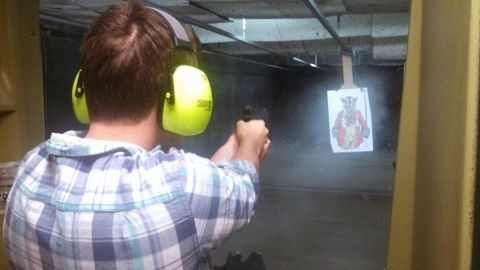 1988 Ford Bronco - Man practicing at an indoor shooting range.