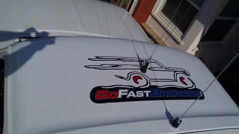 1996 Ford Bronco - Decal on a white vehicle reads "Go Fast Broncos" with a stylized outline of a Bronco.