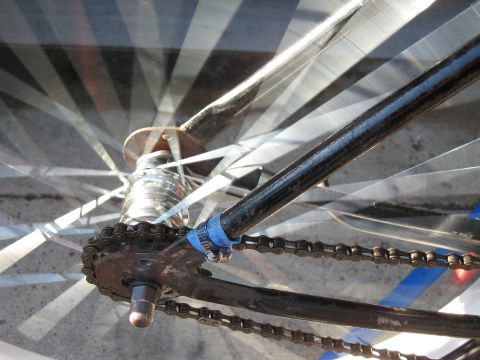 1994 Ford Bronco - Close-up of a bicycle's drivetrain and wheel, showing the chain and spokes.