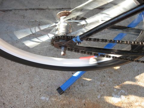 1994 Ford Bronco - Close-up of a bicycle's rear wheel and drivetrain, captured in motion.