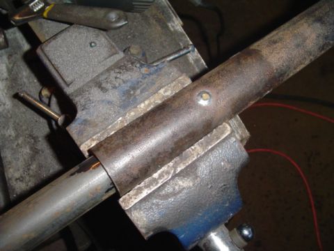 1993 Ford Bronco - An antiwrap bar is secured in a vise, ready for modification or repair.