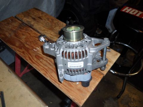 1994 Jeep Cherokee - This is an automotive alternator, a crucial component for charging the vehicle's battery.