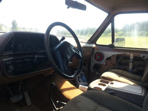 1988 Ford Bronco - Interior view of a 1988 Ford Bronco, highlighting the dashboard and seating area.