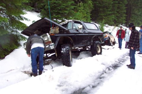 1996 Ford Bronco - Yup, back in the ditch again. But this time broke the steering gearbox sector shaft while tying to get out. (12/13/2003)